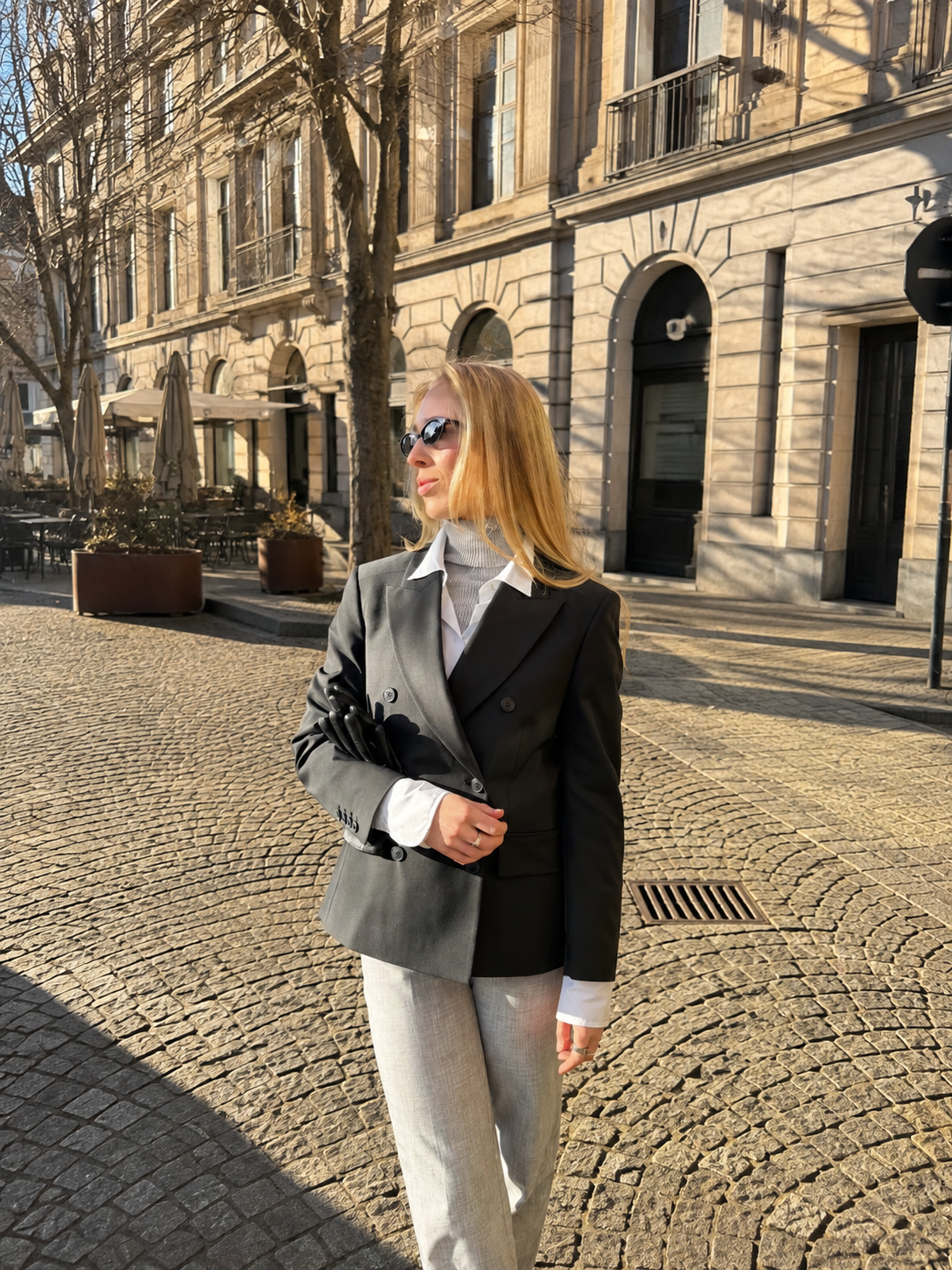 Woman wearing The Midnight blazer outdoors